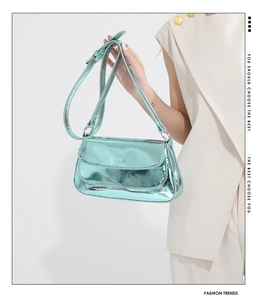 Detail of mint green metallic PU shoulder bag with adjustable strap and flap closure