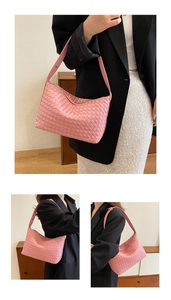 Close-up of the intricate woven texture and soft pink leather finish of the hobo bag