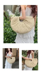 Detailed macro view of a beige crescent woven straw tote bag with round handle