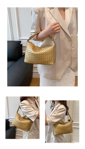 Detailed close-up showing the metallic gold woven texture and hobo style of the handbag