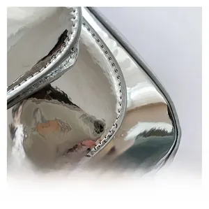 Detail shot of the glossy silver metallic PU leather with high-quality stitching craft