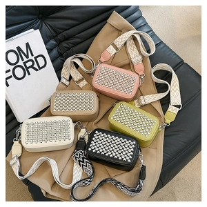 Top view of five rhinestone crossbody bags in pink, khaki, green, white, and black colors