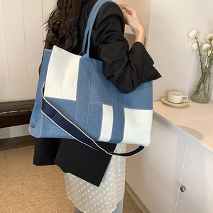 Large denim canvas tote bag with blue and white patchwork for commuting and casual wear