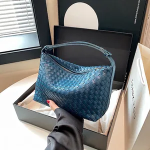 Dark blue woven leather hobo bag with top handle in an elegant gift box set