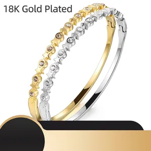 Set of gold and silver stainless steel bangles with star patterns and inlaid zircons