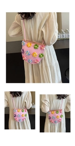 Detail of handmade crochet crossbody bag with colorful knit flowers and pink rope weaving