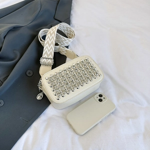 Sparkling studded crossbody bag in beige with wide strap and silver rivet details