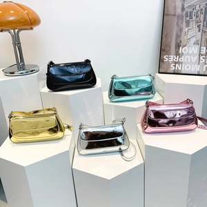 Glossy high-shine shoulder bags in black, gold, silver, green, and pink colors