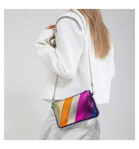 Close-up of colorful metallic stripe crossbody bag with iconic chain-link trim detail