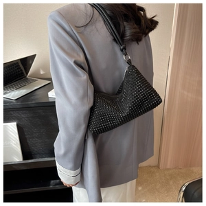 Chic black rhinestone shoulder bag shown on model for a modern luxury fashion look