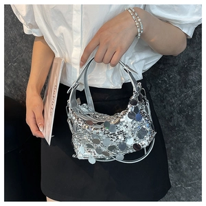 Detail of silver sequin hobo bag with dangling circular sequins and elegant hobo shape