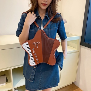 Star-shaped accordion style backpack in brown patchwork with piano key pattern details