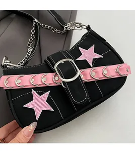 Detail of Y2K shoulder bag with pink star patches and metallic chain hardware