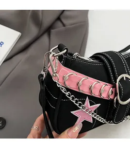 Detail of Y2K canvas shoulder bag with pink star embroidery and metal chain accents