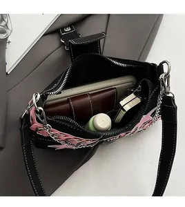 Internal view of black Y2K shoulder bag showing spacious storage for daily essentials