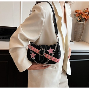 Detail of Y2K shoulder bag with pink star embroidery and silver metal chain strap