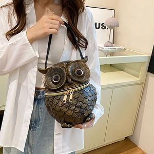 Unique owl-shaped crossbody bag with metallic feather relief and dual gold zippers