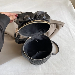 Unique owl-shaped embossed black crossbody bag with metallic leather and golden hardware