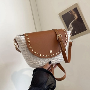 Bohemian straw woven crossbody bag with brown leather flap and golden rivet studs