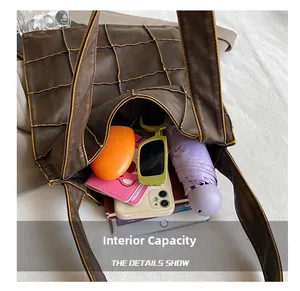 Top view of brown quilted tote bag showing large capacity for tablet and daily items