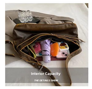 Internal capacity of the vintage brown leather shoulder bag showing daily essentials