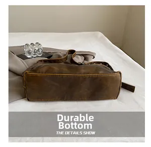 Detail view of the durable wear-resistant bottom on retro brown leather shoulder bag