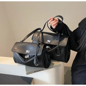 Detailed comparison of large and small black leather handbags with silver turn-lock clasp