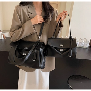 Size comparison of large and small black handbags with silver rotating buckles