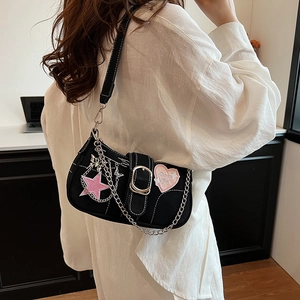 Y2K style black shoulder bag with pink star patches and Dream Girl heart embroidery
