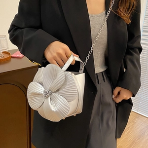 Silver bucket bag with 3D flower decoration, metallic top-handle and chain strap