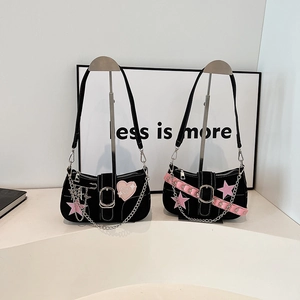 Y2K style black shoulder bags with pink heart patches and silver chain accents