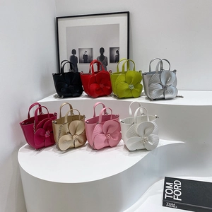 Eight colors of mini floral tote bags with satin finish and metallic chain straps