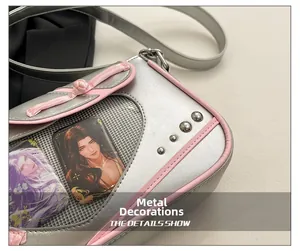 Detail of silver ita bag with pink trim, metal rivets and mesh pocket for anime cards