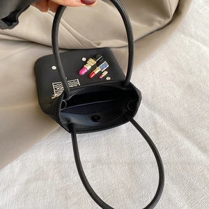 Mini nylon crossbody bag in black featuring sparkly rhinestone lipstick embroidery and handles