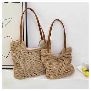 Detail of woven mesh tote bags in two sizes with brown leather handles and rivets