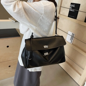 Minimalist black faux leather oversized shoulder bag with silver metallic buckles