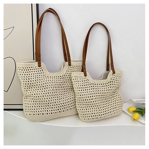 Detail of woven mesh tote bags showing beige cotton texture and brown leather straps