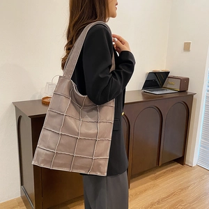Chic grey-brown quilted tote bag with wide strap for stylish daily office commuting