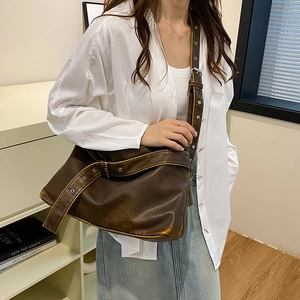 Retro deep brown oversized faux leather shoulder bag with wide grommet strap