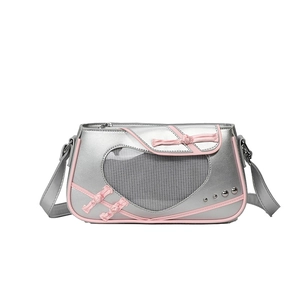 Silver shoulder bag with pink trim, heart window, and bow in a minimalist design