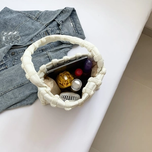 Spacious interior of white puff cloud shoulder bag showing iPad, umbrella and daily items