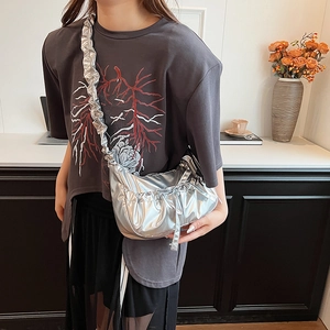 Silver metallic pleated crossbody bag with half-moon shape and wide strap style