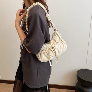 Minimalist cream pleated underarm canvas bag with bow decoration and wide shoulder strap
