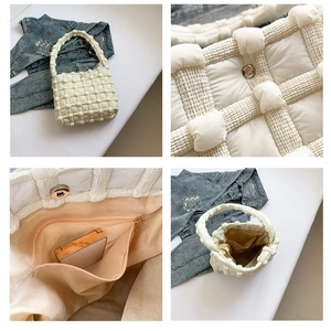 White puffer quilted tote bag with soft woven texture and spacious interior compartment