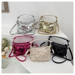 Five assorted sequin handbags in silver gold and pink colors displayed on steps
