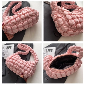 Pink quilted bubble bag featuring pleated texture and soft cloud-like puff design
