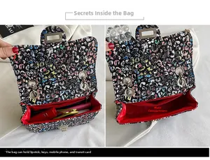 Detail view of the colorful weave pattern chain bag showing red interior capacity for phone