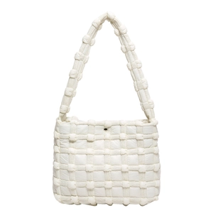 Minimalist white quilted shoulder bag with woven texture and metallic snap button closure