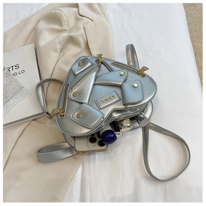 Silver heart-shaped crossbody bag with moto jacket design and zipper details