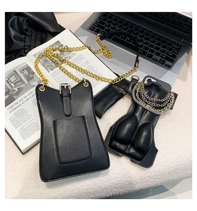 Detail of creative black leather 3D hip shaped phone case with golden chain strap